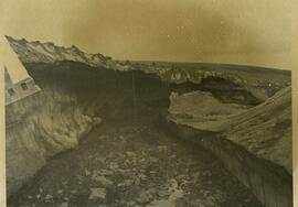 Summer meltwater erosion impacts, on and below pocked ice and snow