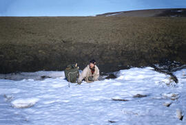 Richard Moskal stuck in a gully trying to cross. Snow was wet and slushy with a stream flowing be...
