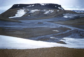In the valleys, softer silt materials moved by melt waters to the sea. Lava material still standi...