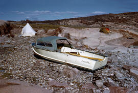 Our small pitched tent on on shore of Quilliam Bay, with aluminum boat to travel coast line from ...