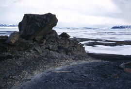 Hardened lava material with weathered soft scorched rock material abutting the lava material. Loc...