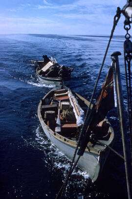 Slides taken on a boat that moved V. Sim and R. Moskal to Igloolik. Slides show boats being towed...